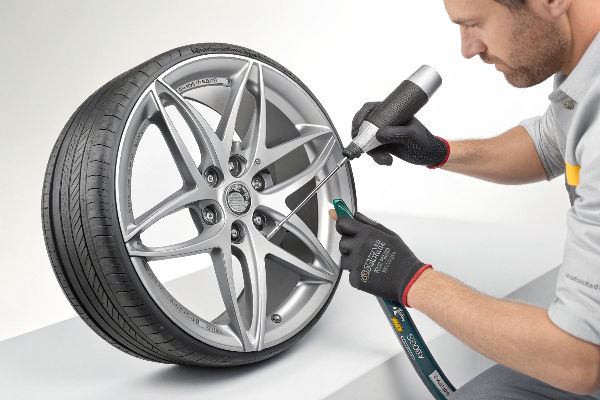 Technician repairing cosmetic wheel damage cosmetic wheel damage repair