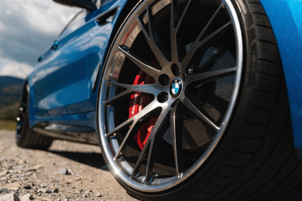 Brushed forged wheels on blue BMW M5