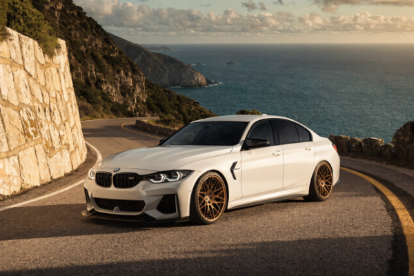 white BMW M3 with bronze wheels
