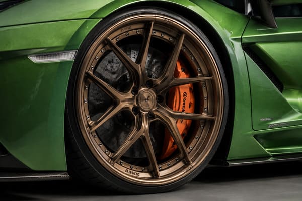 Bronze forged wheels on green Lamborghini Aventador