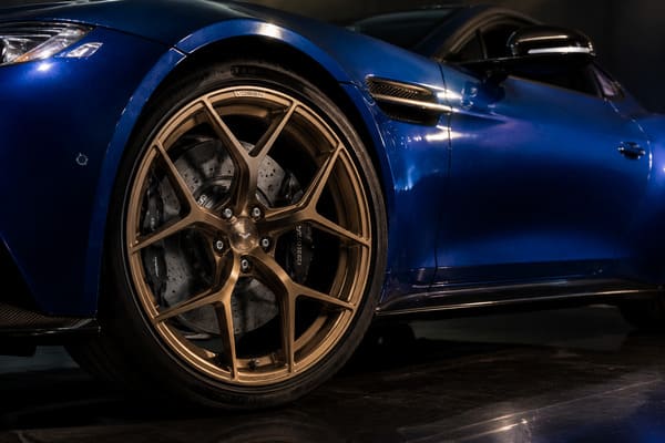 Brushed bronze wheels on blue Aston Martin Vantage Brushed bronze wheels on blue Aston Martin Vantage