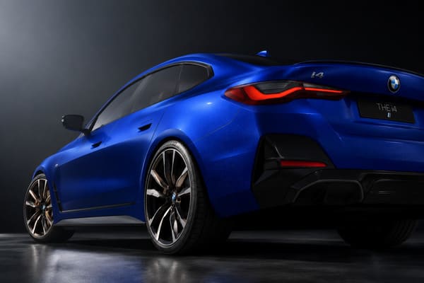 Black Wheels on Blue BMW i4 Aggressive Style\ Matte black forged wheels on blue BMW i4 aggressive look